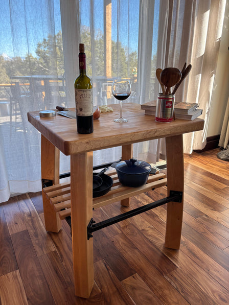 Solid maple kitchen prep table with steel bracing in warm natural light